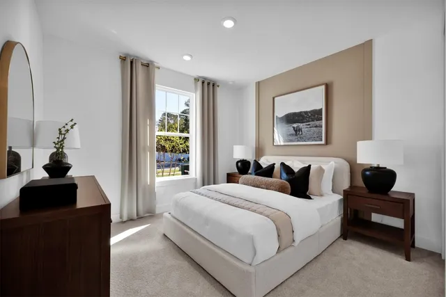 a bedroom with a bed and a couch