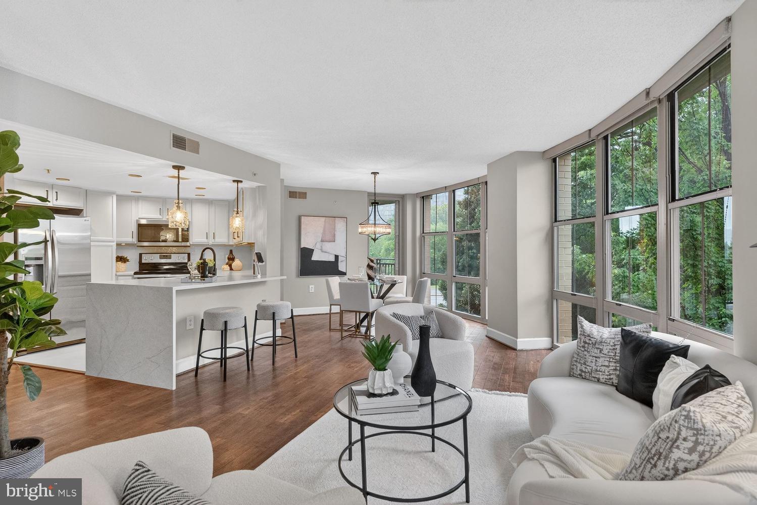 11800 Sunset Hills Road, Unit 314 Reston, VA 20190 - Photo 8 of 50 a living room with furniture and a large window