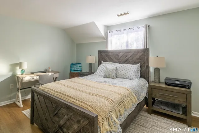 a bedroom with a bed and a closet