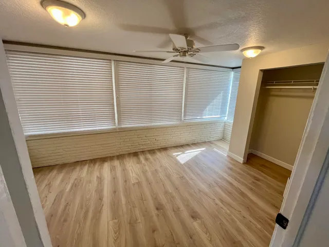 a dining room with furniture and a window
