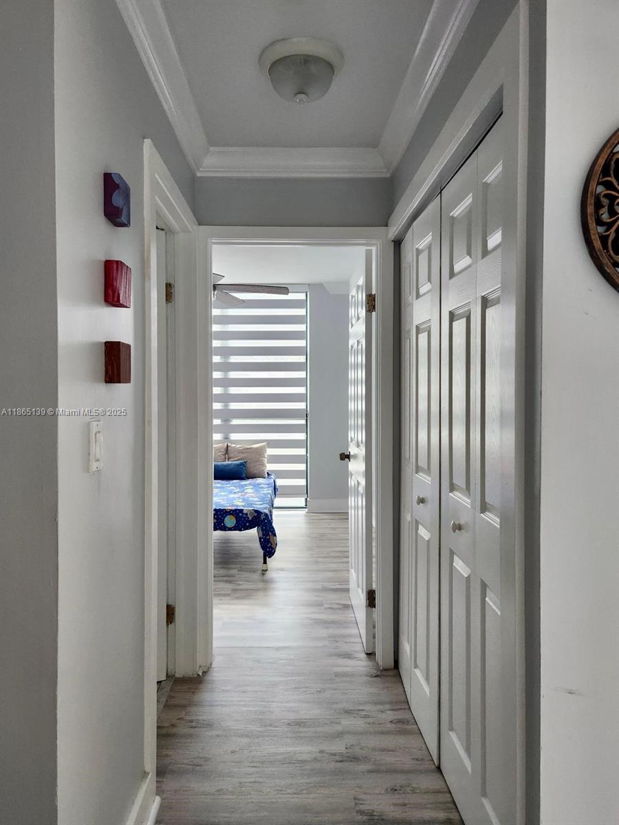 11790 Southwest 18th Street, Unit 2183 Miami, FL 33175 - Photo 15 of 28 a view of a hallway and interior of a house and wooden floor
