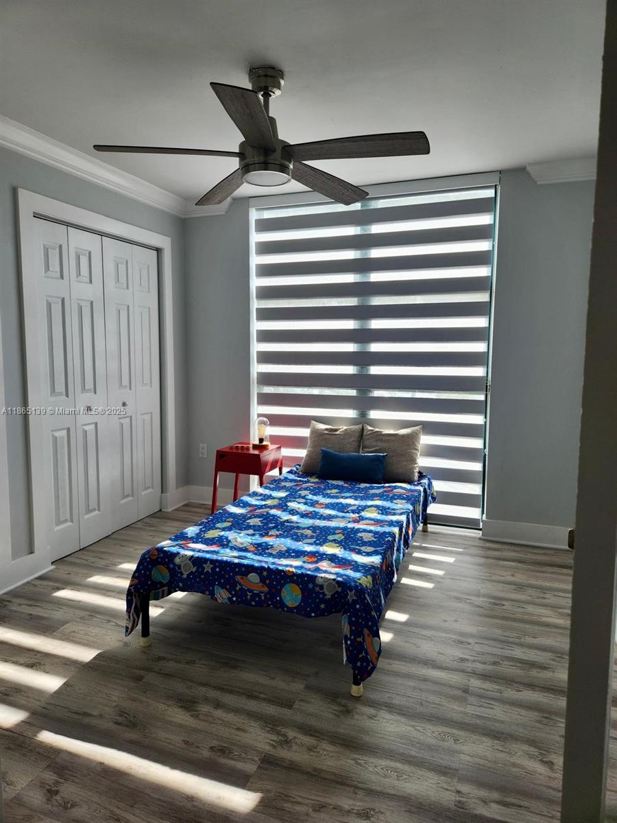 11790 Southwest 18th Street, Unit 2183 Miami, FL 33175 - Photo 16 of 28 a view of a room with wooden floor and furniture