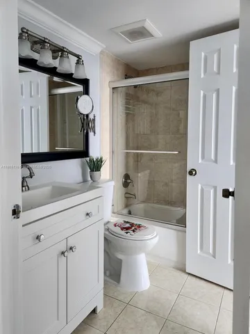 a bedroom with a bed and a chair