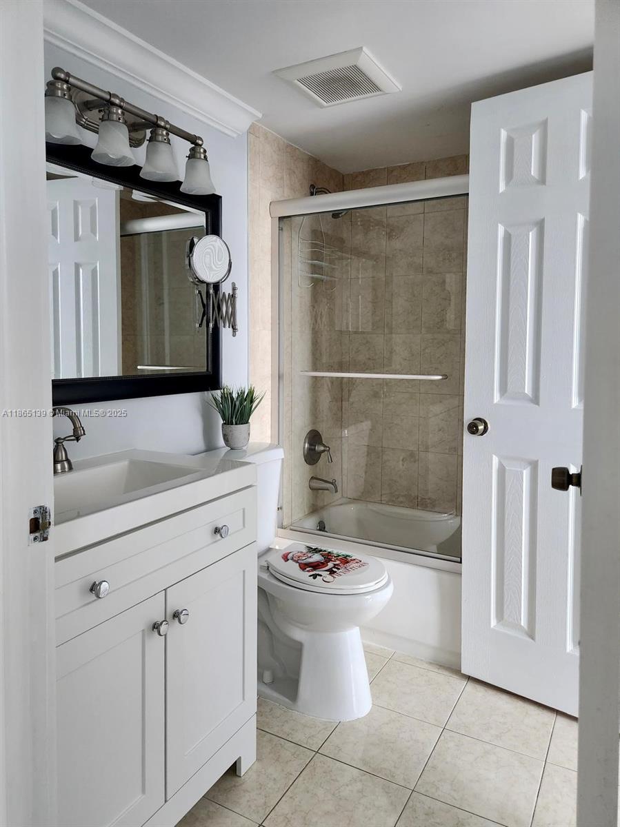 11790 Southwest 18th Street, Unit 2183 Miami, FL 33175 - Photo 17 of 28 a bathroom with a sink toilet and shower