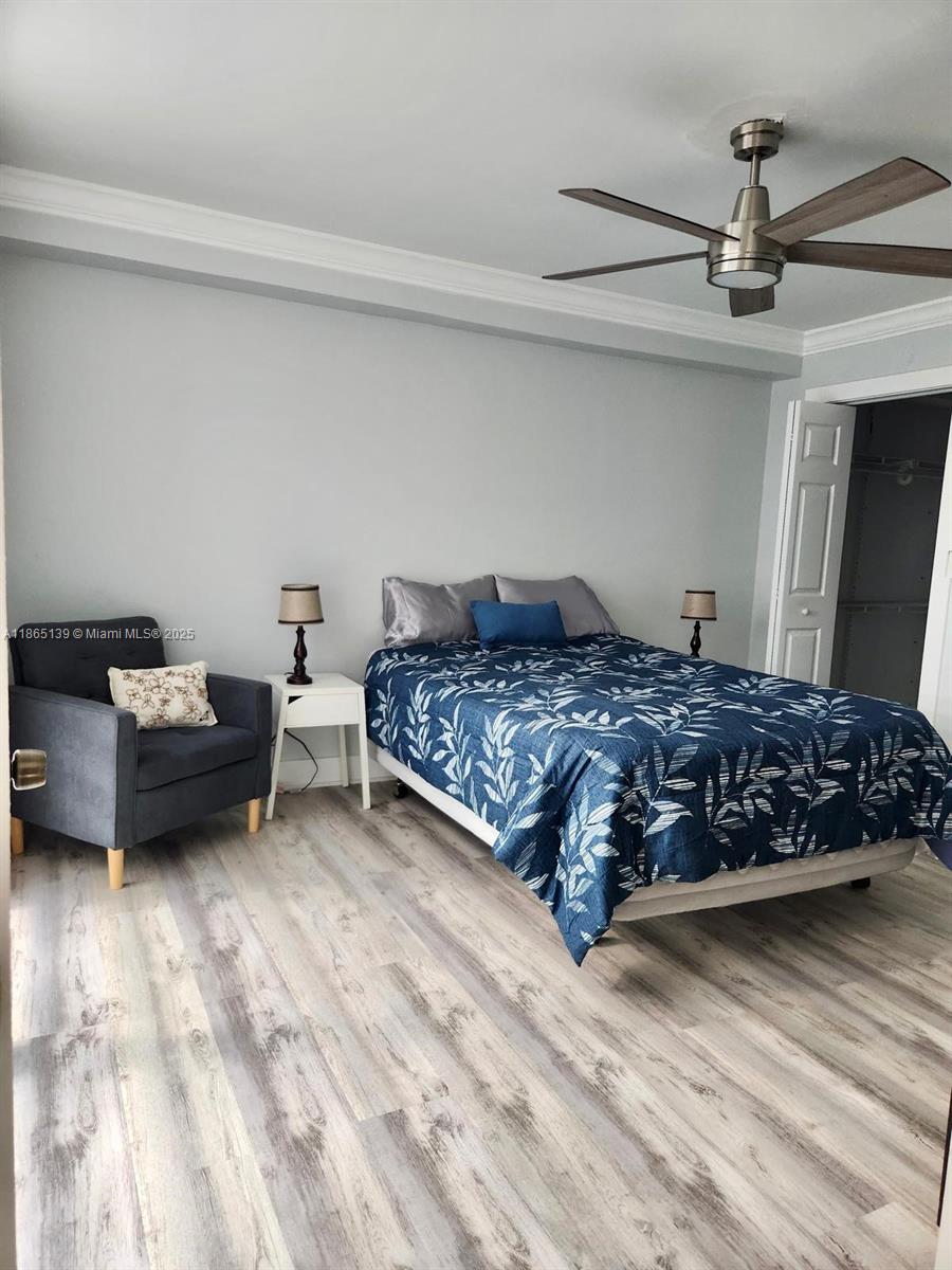 11790 Southwest 18th Street, Unit 2183 Miami, FL 33175 - Photo 18 of 28 a bedroom with a bed and a chair