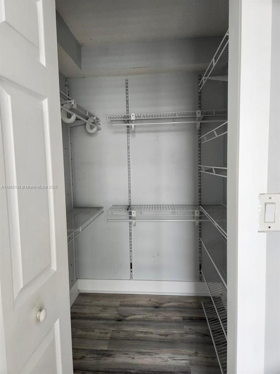 11790 Southwest 18th Street, Unit 2183 Miami, FL 33175 - Photo 20 of 28 a view of an empty walk in closet