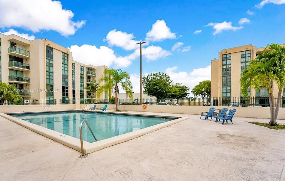 11790 Southwest 18th Street, Unit 2183 Miami, FL 33175 - Photo 27 of 28 a view of a patio with swimming pool