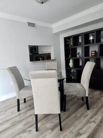 a kitchen with a refrigerator and a sink