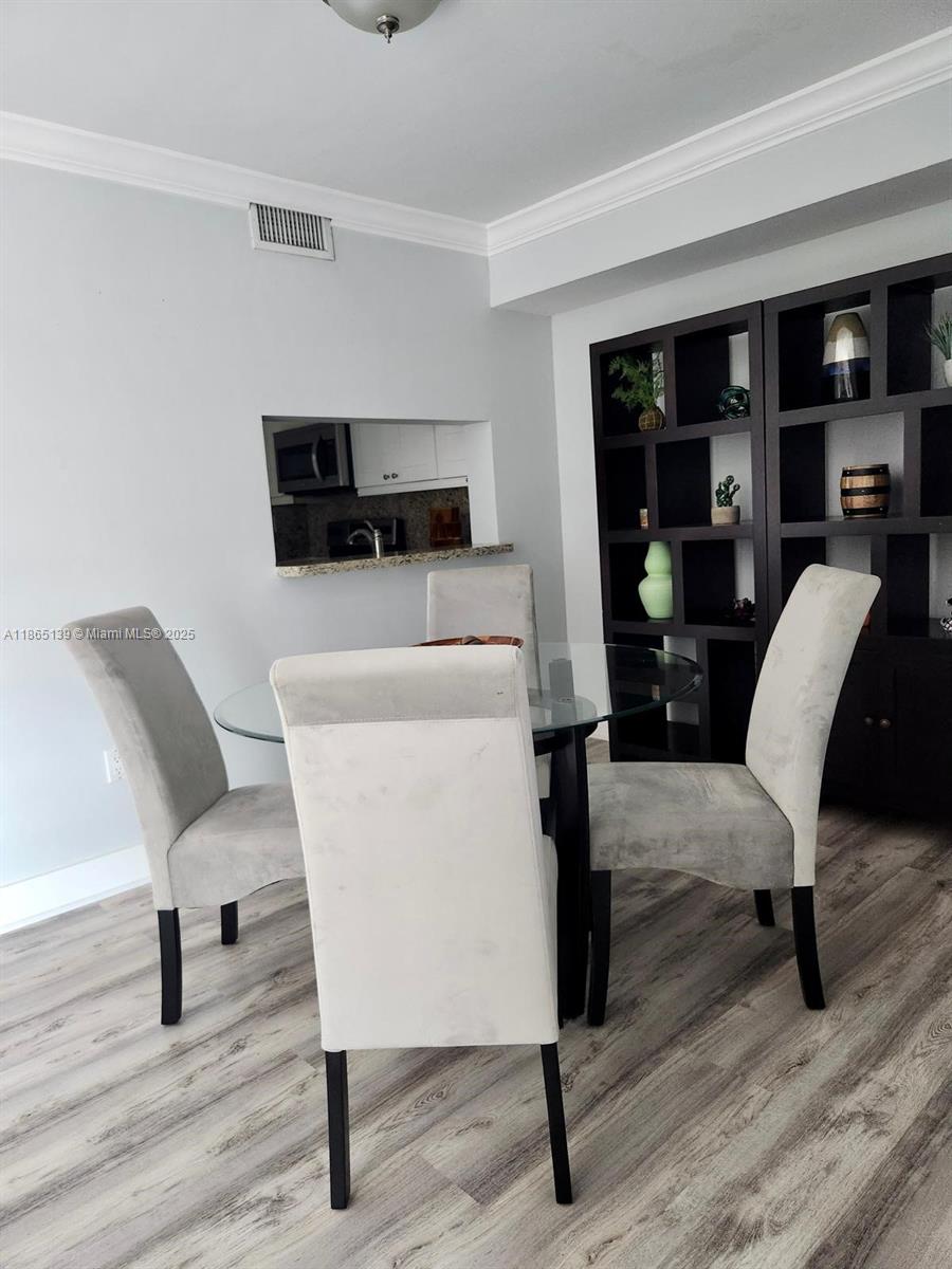 11790 Southwest 18th Street, Unit 2183 Miami, FL 33175 - Photo 10 of 28 a living room with furniture and a flat screen tv