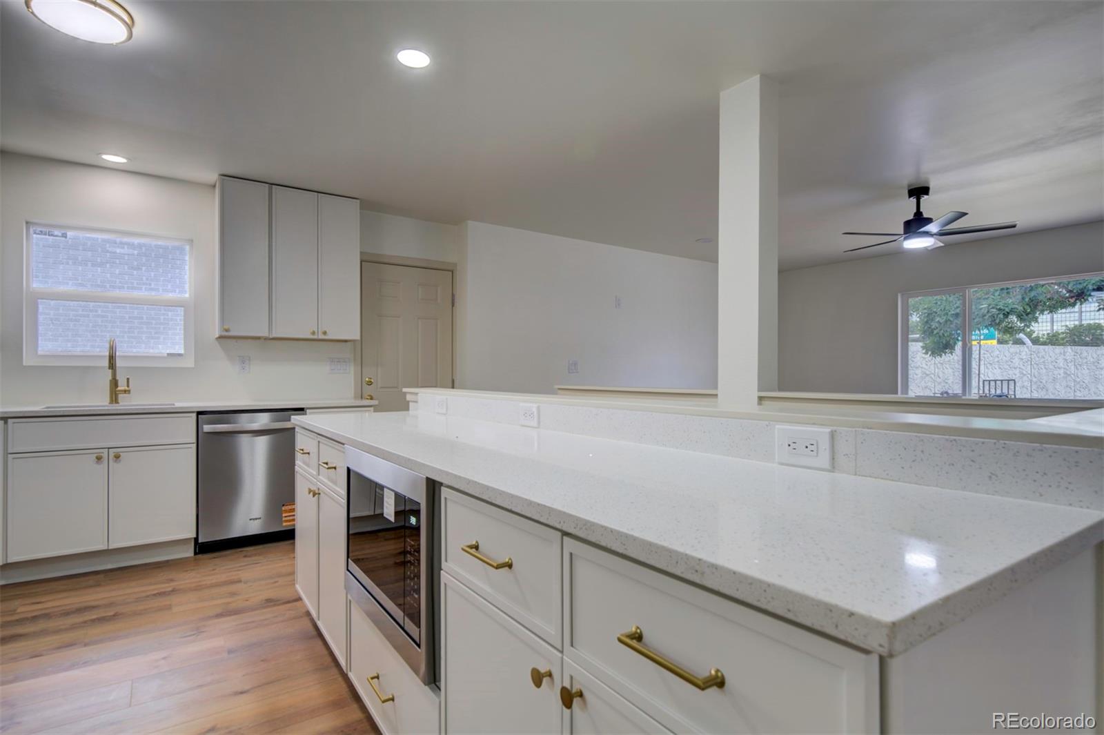 1815 South Monroe Street Denver, CO 80210 - Photo 14 of 37 a kitchen with a sink and cabinets