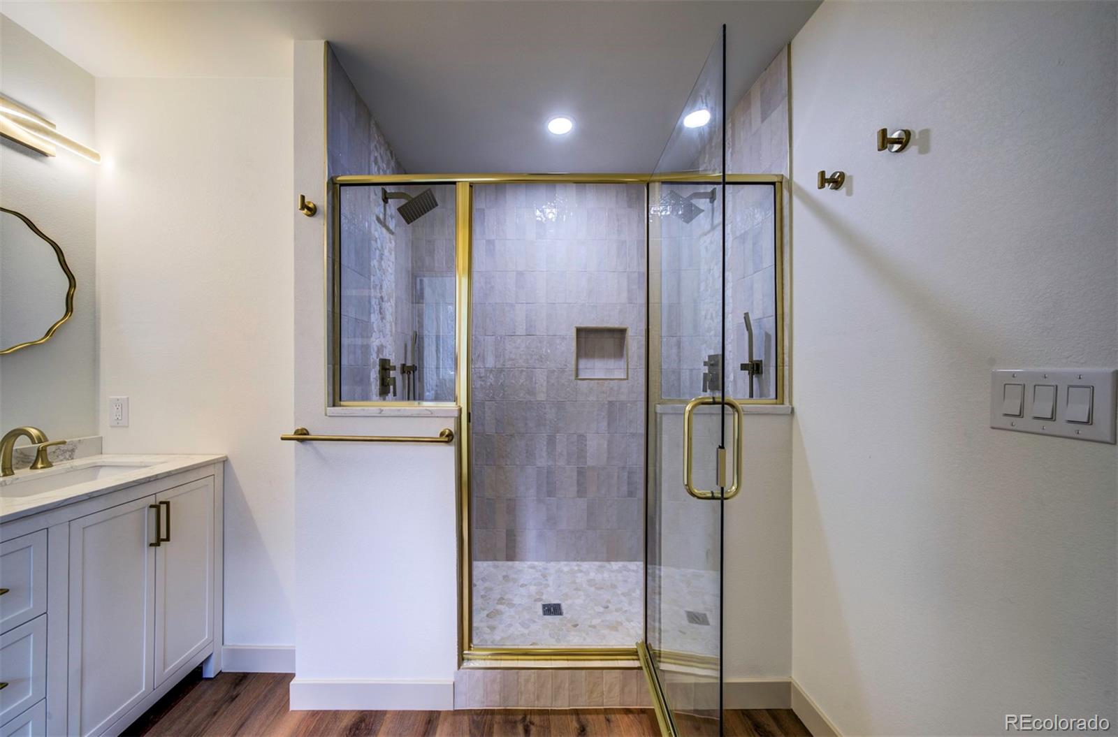 1815 South Monroe Street Denver, CO 80210 - Photo 18 of 37 a bathroom with a shower and a sink