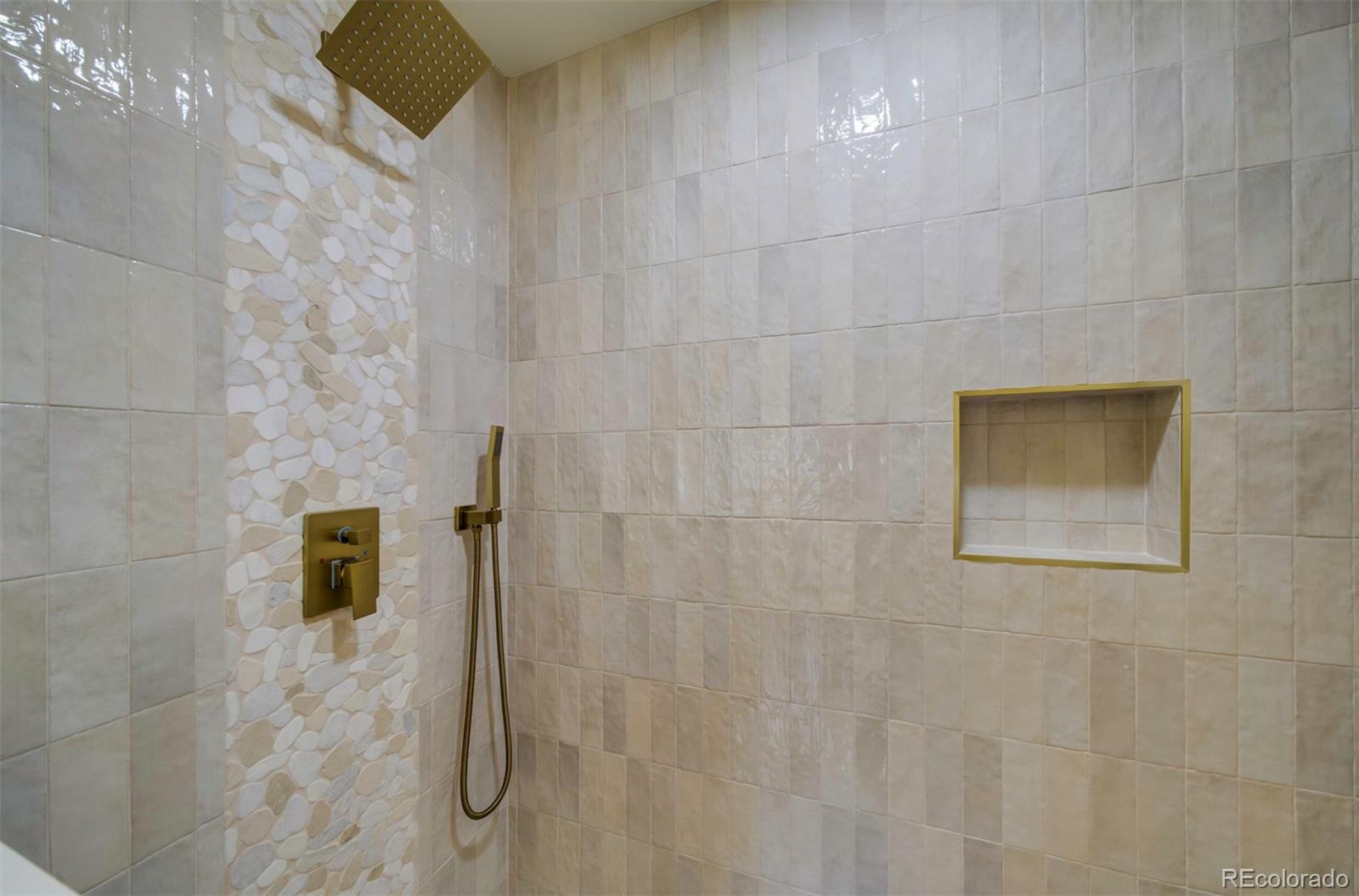 1815 South Monroe Street Denver, CO 80210 - Photo 21 of 37 a bathroom with a shower