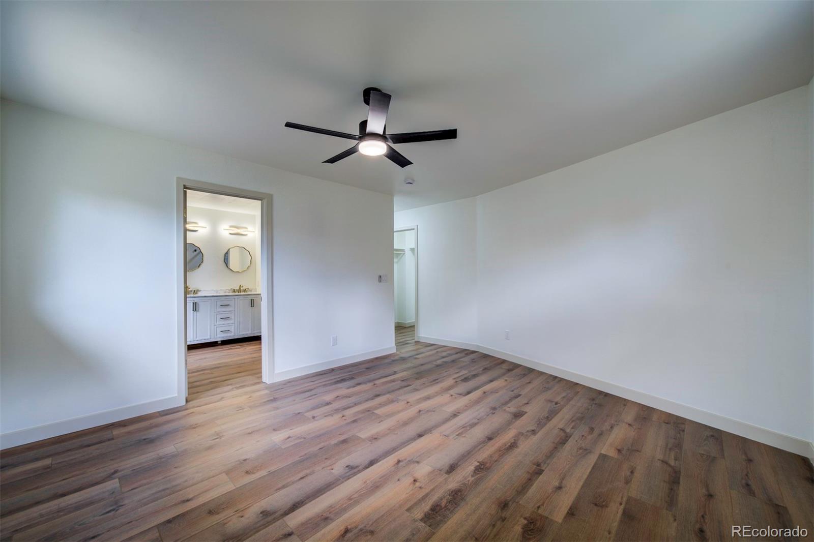 1815 South Monroe Street Denver, CO 80210 - Photo 25 of 37 a view of empty room with wooden floor