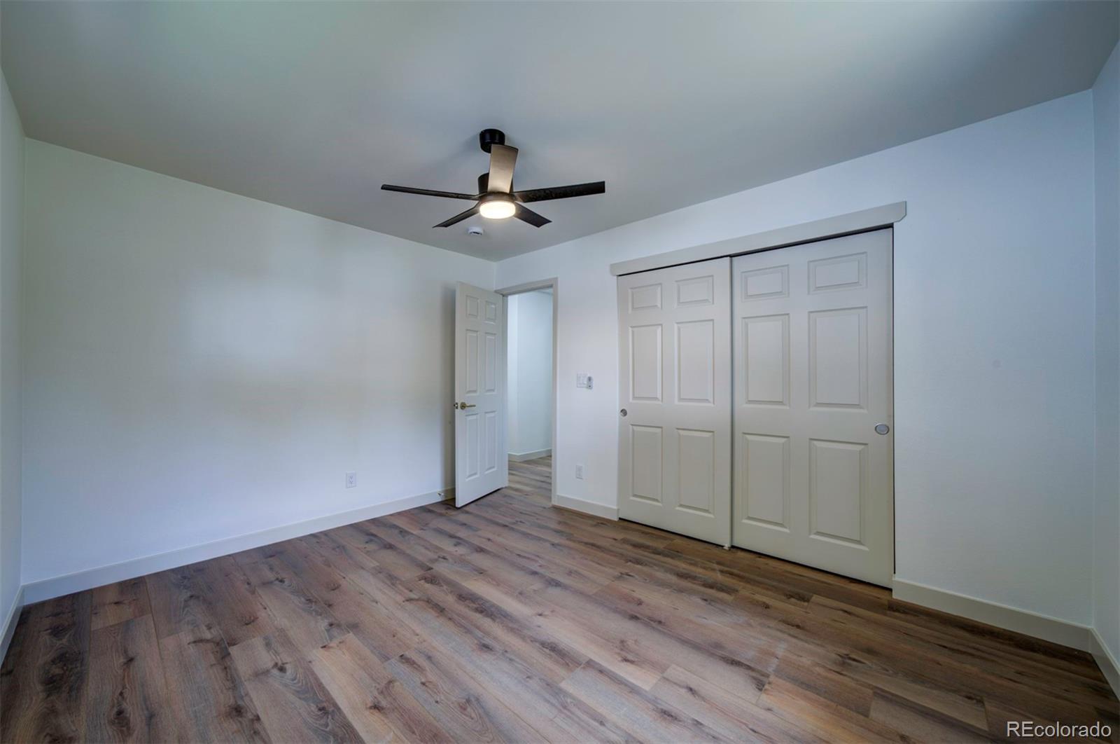 1815 South Monroe Street Denver, CO 80210 - Photo 28 of 37 a view of an empty room with wooden floor