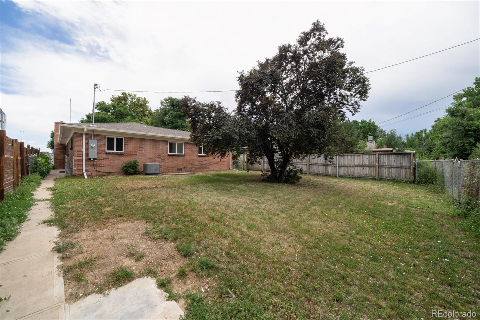 1815 South Monroe Street Denver, CO 80210 - Photo 3 of 37 a view of house with outdoor space and garden