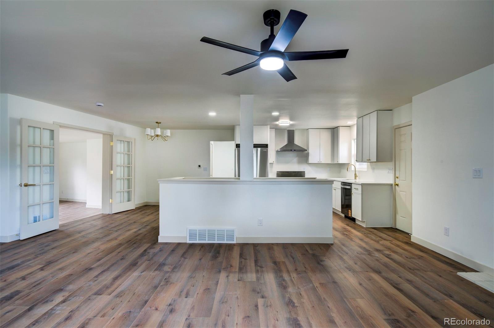 1815 South Monroe Street Denver, CO 80210 - Photo 8 of 37 a view of kitchen with cabinets appliances and wooden floor
