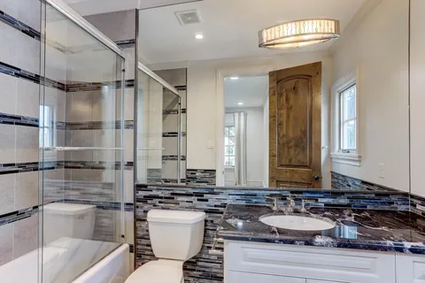 a bedroom with two beds and a window