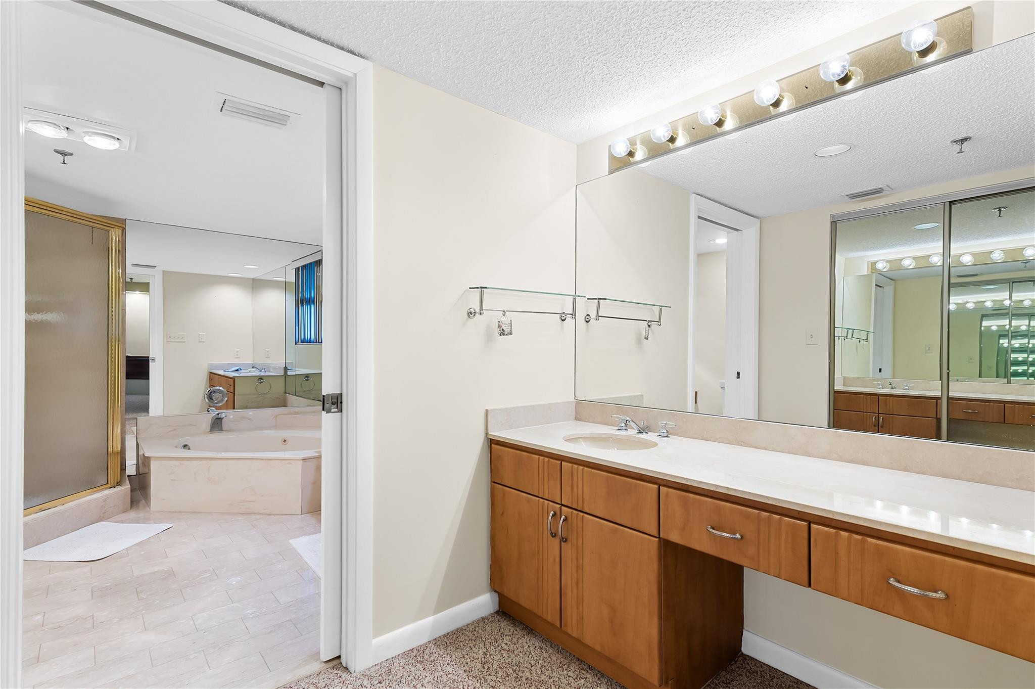 7580 Regency Lakes Drive, Unit 101 Boca Raton, FL 33433 - Photo 22 of 35 2 separate vanities, shower & jetted tub