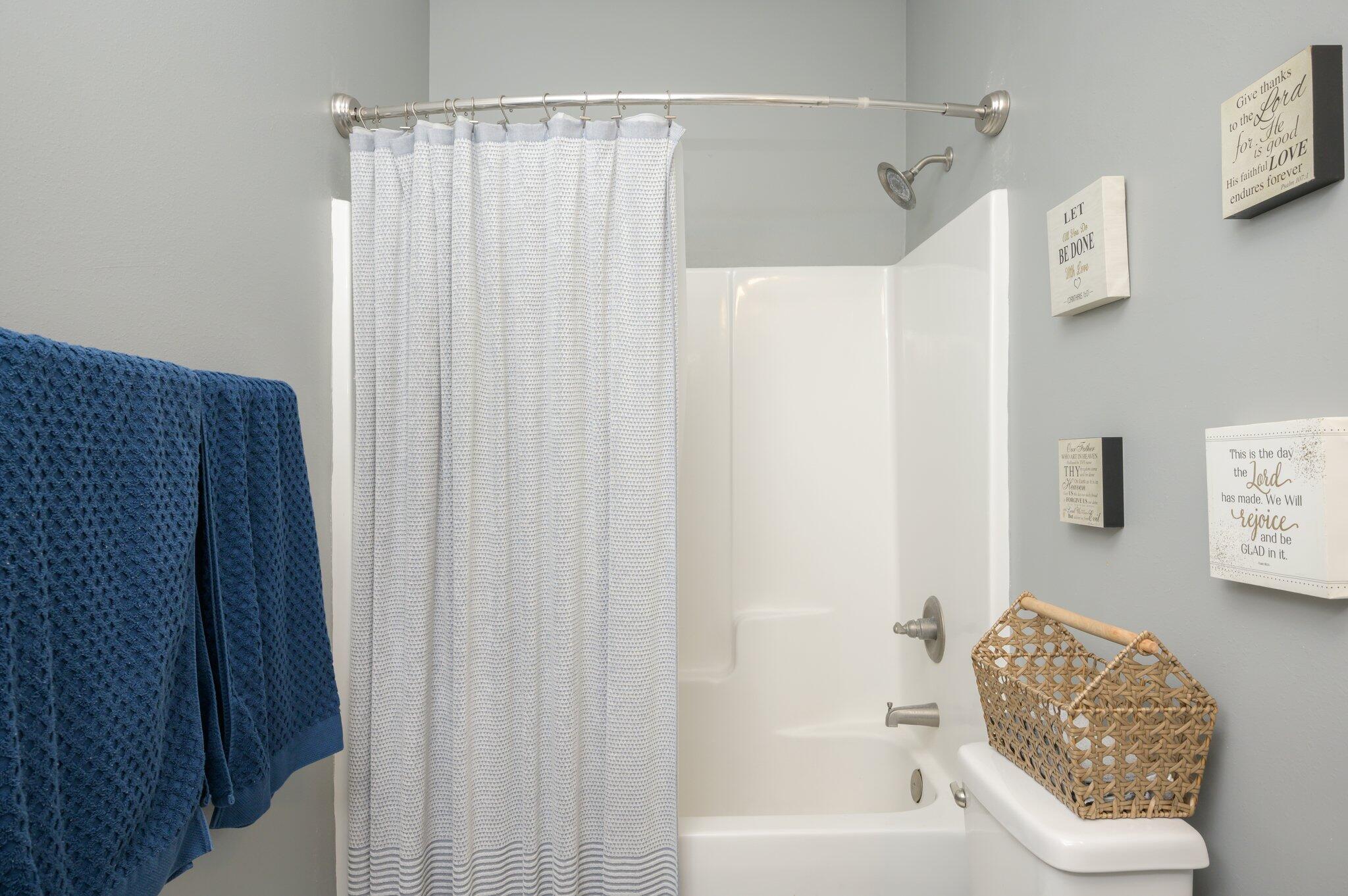 5620 Price Plantation Road Baker, FL 32531 - Photo 11 of 37 a bathroom with a shower curtain and a sink