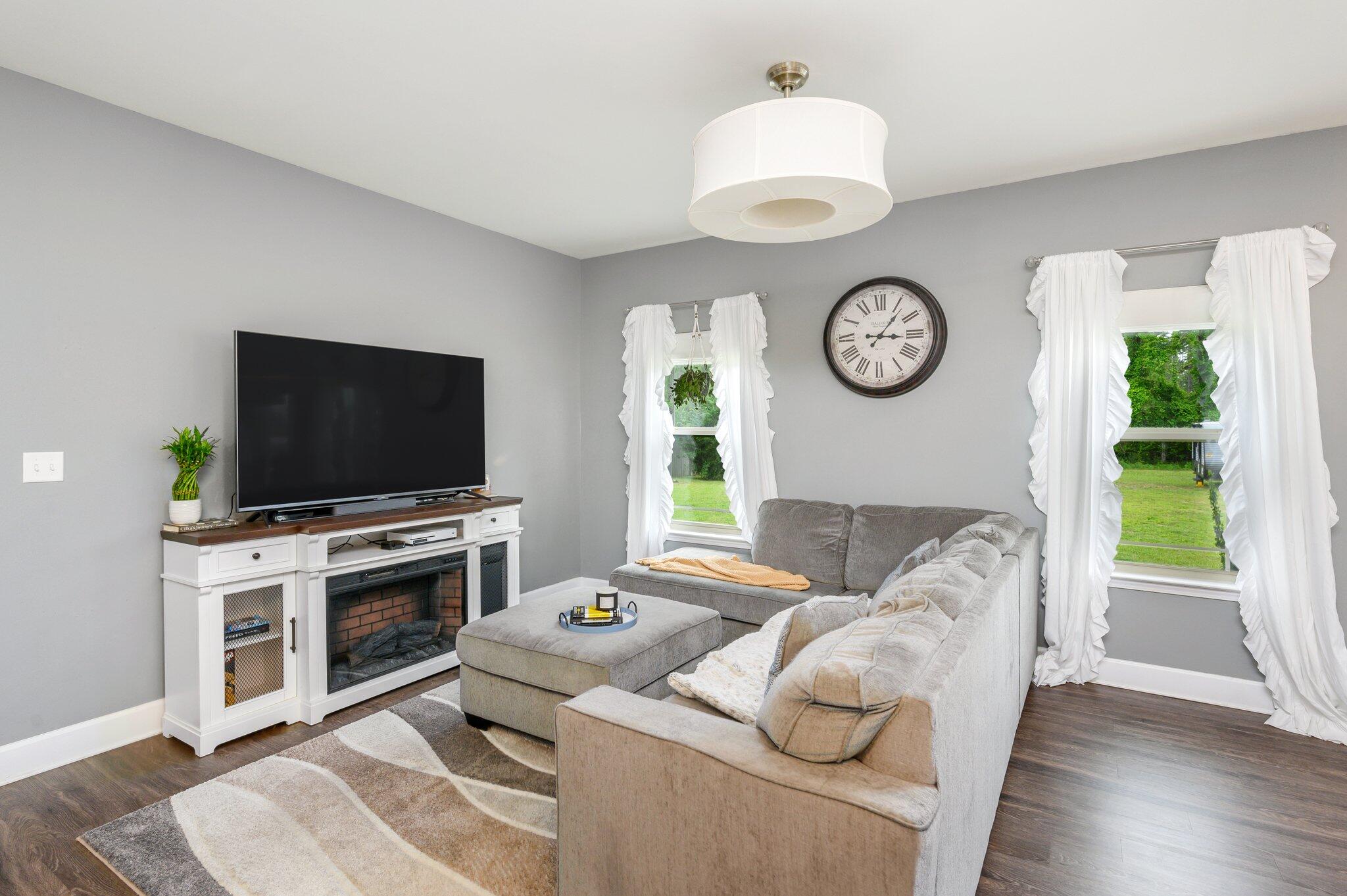 5620 Price Plantation Road Baker, FL 32531 - Photo 13 of 37 a living room with furniture and a flat screen tv
