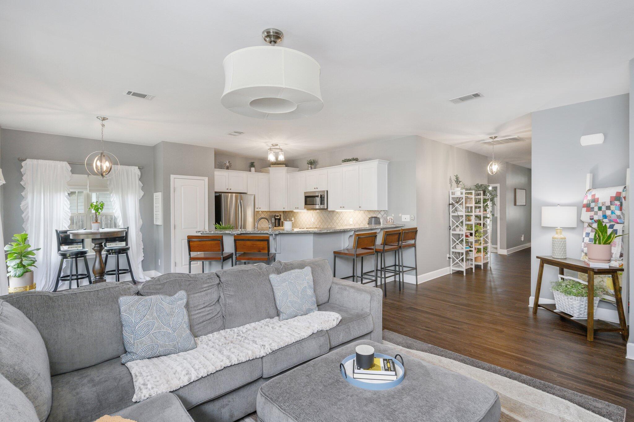 5620 Price Plantation Road Baker, FL 32531 - Photo 15 of 37 a living room with furniture and kitchen view