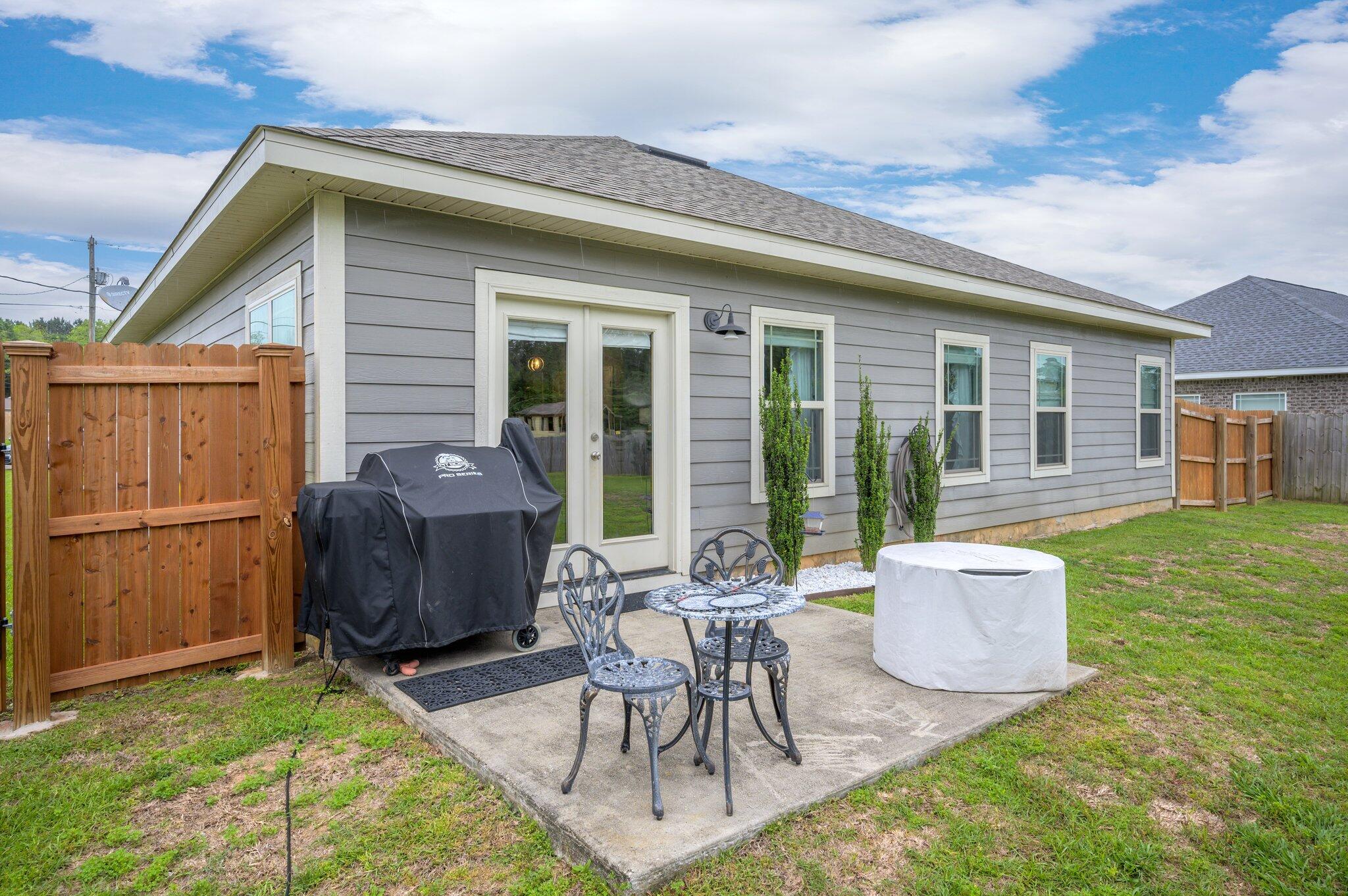 5620 Price Plantation Road Baker, FL 32531 - Photo 32 of 37 a view of backyard with a patio and outdoor seating