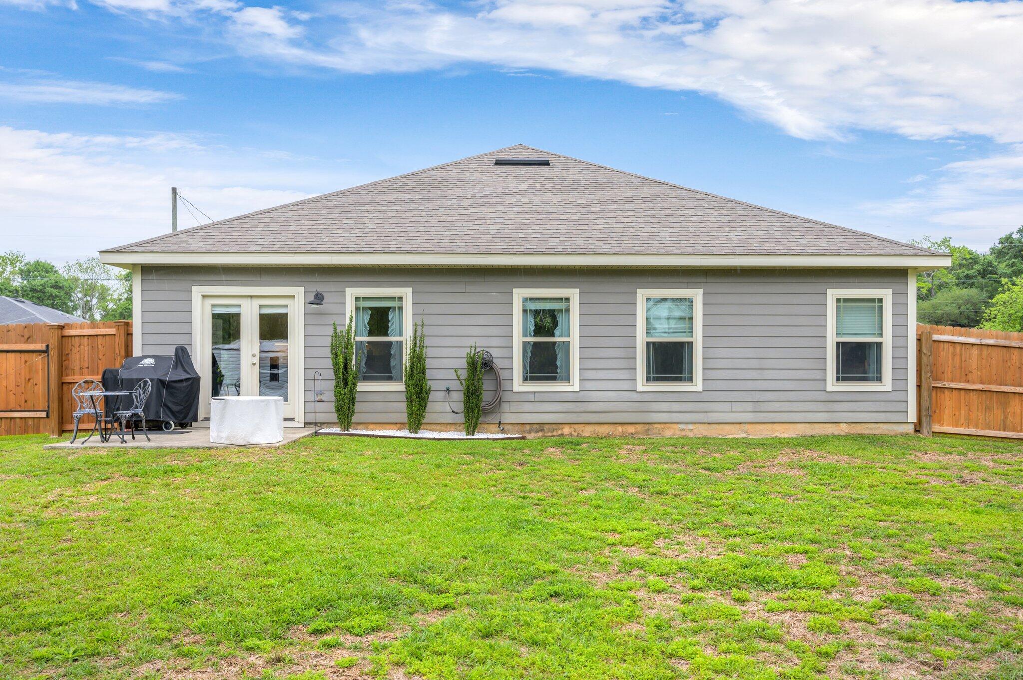 5620 Price Plantation Road Baker, FL 32531 - Photo 35 of 37 a front view of house with yard outdoor seating and barbeque oven