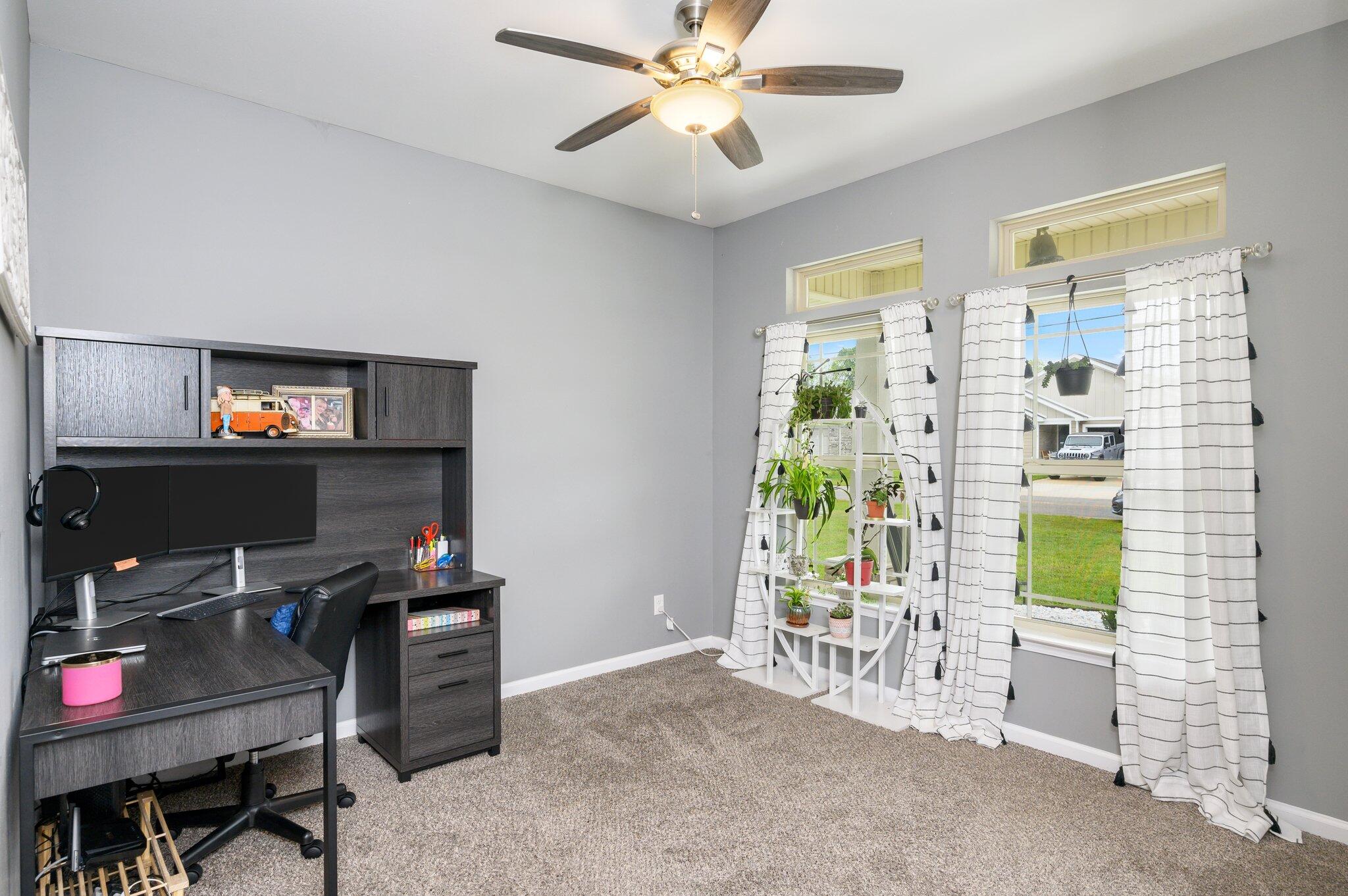 5620 Price Plantation Road Baker, FL 32531 - Photo 6 of 37 a workspace with furniture and a window