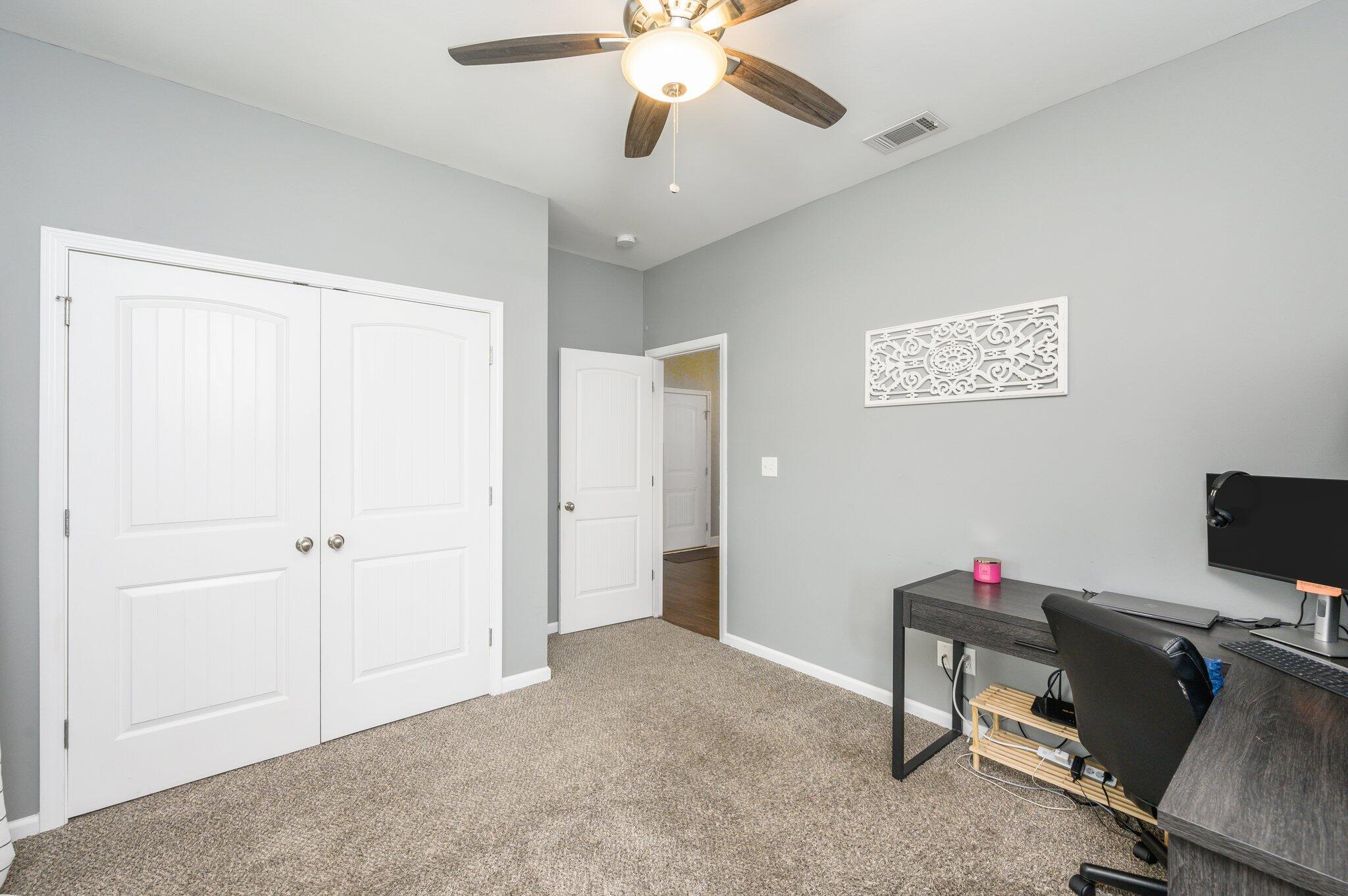 5620 Price Plantation Road Baker, FL 32531 - Photo 7 of 37 a view of a workspace with furniture and a window