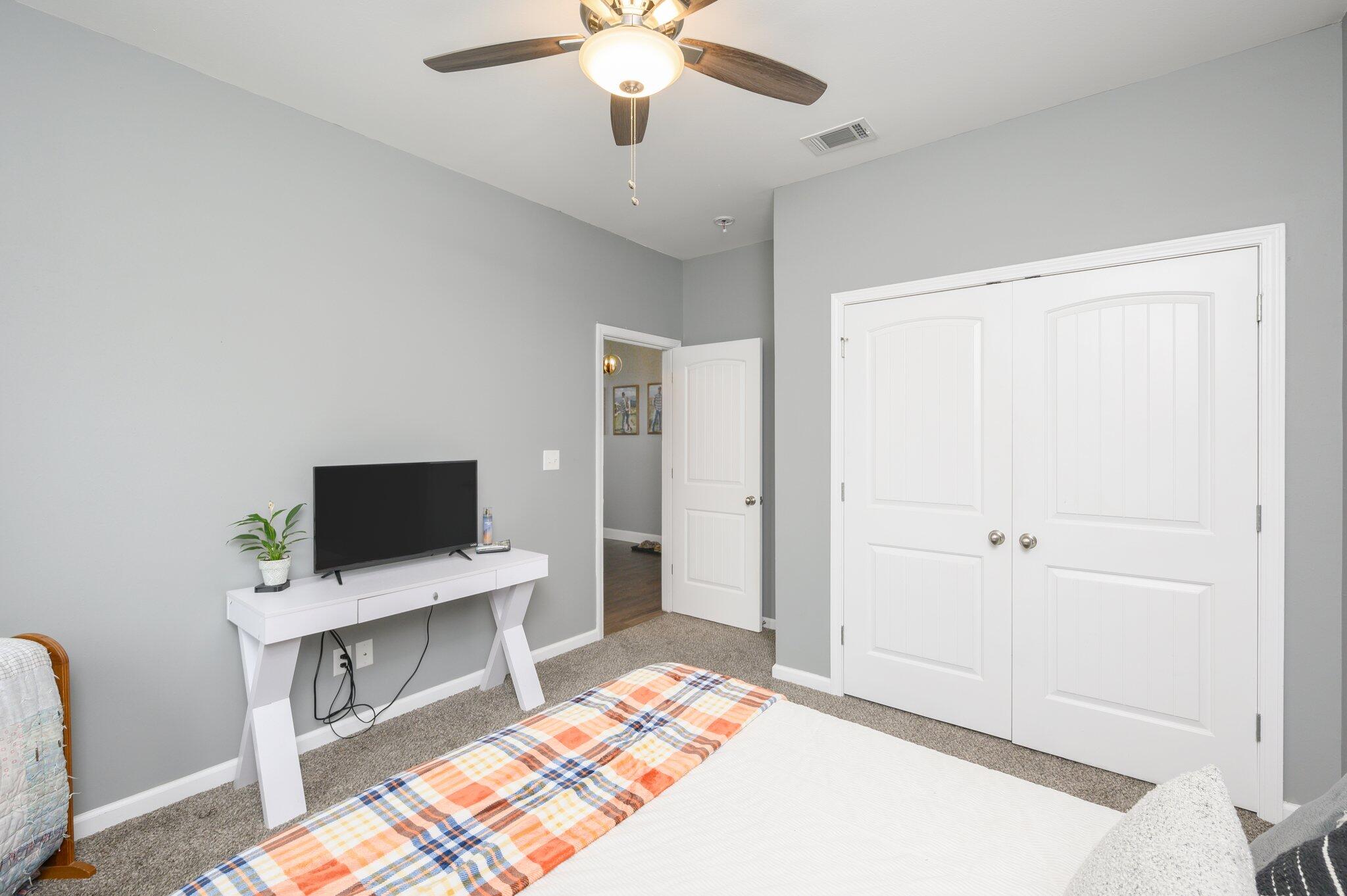 5620 Price Plantation Road Baker, FL 32531 - Photo 9 of 37 a bedroom with a bed and a flat screen tv