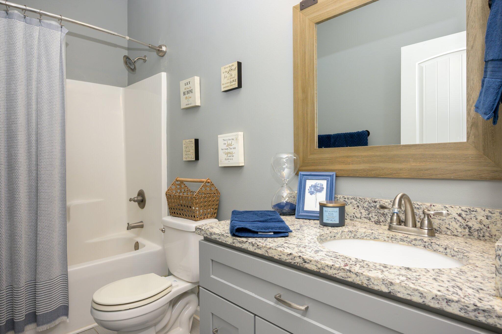 5620 Price Plantation Road Baker, FL 32531 - Photo 10 of 37 a bathroom with a granite countertop sink a toilet and shower