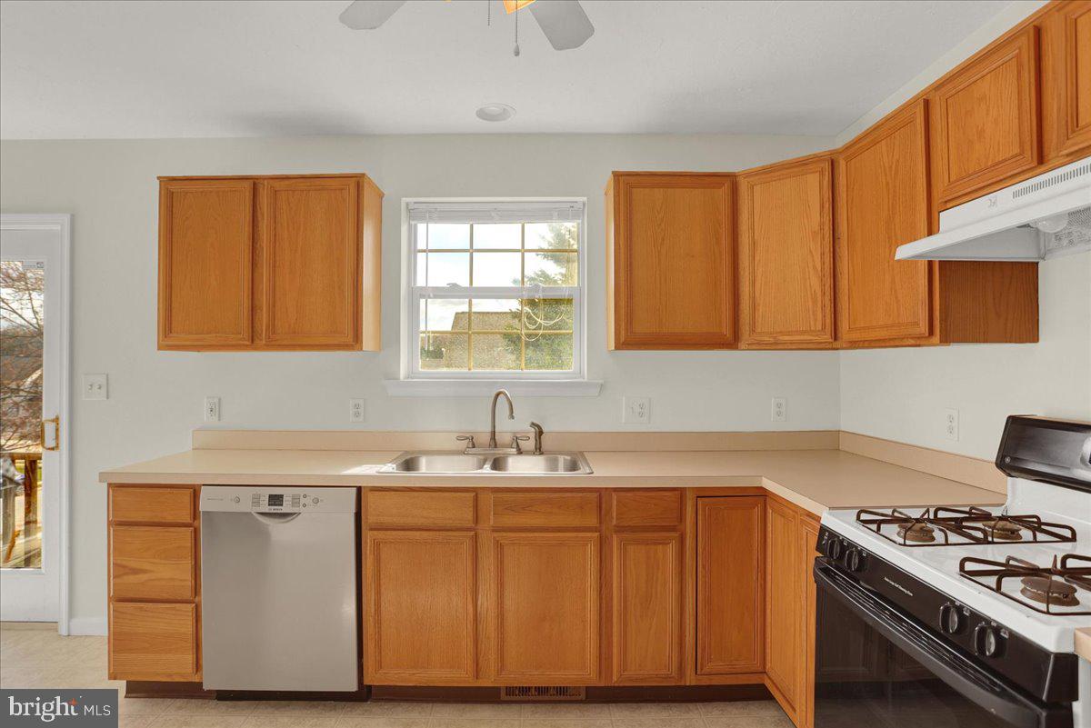 1180 Wanda Drive Hanover, PA 17331 - Photo 13 of 37 a kitchen with stainless steel appliances granite countertop a sink stove and cabinets