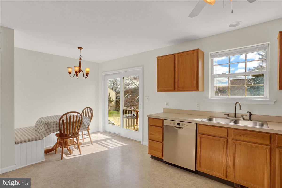 1180 Wanda Drive Hanover, PA 17331 - Photo 14 of 37 a dining room with a sink a chandelier and a window