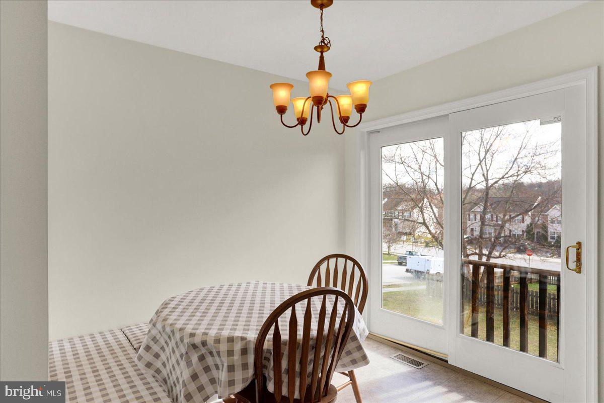 1180 Wanda Drive Hanover, PA 17331 - Photo 15 of 37 a view of a dining room with furniture window and outside view
