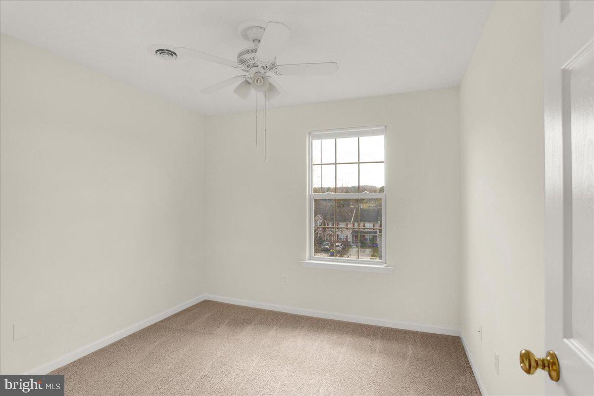 1180 Wanda Drive Hanover, PA 17331 - Photo 23 of 37 an empty room with windows and fan
