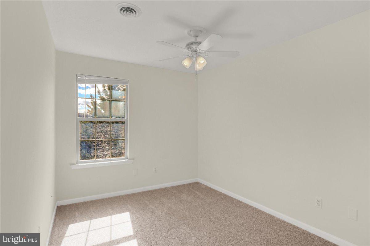 1180 Wanda Drive Hanover, PA 17331 - Photo 26 of 37 an empty room with windows and fan