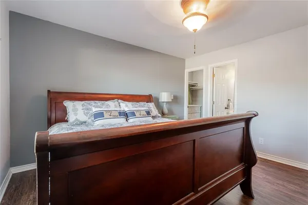 a room with a bed and a chandelier