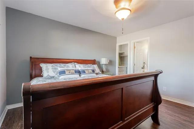 a room with a bed and a chandelier