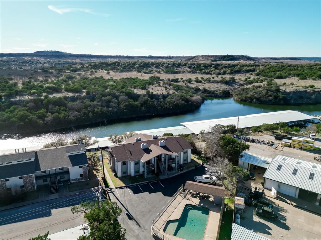 3069 Hells Gate Loop, Unit 26 Strawn, TX 76475 - Photo 19 of 27 a view of a chairs and table in patio