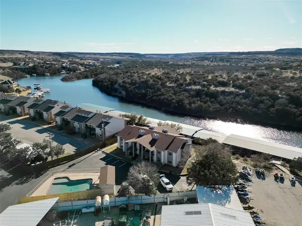 an aerial view of a house with a lake view