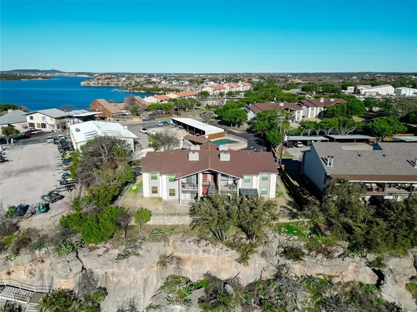 an aerial view of a house with a yard