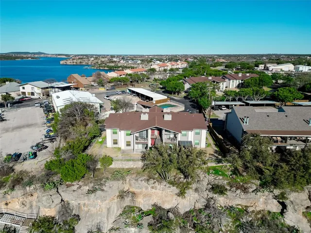 an aerial view of a house with a yard
