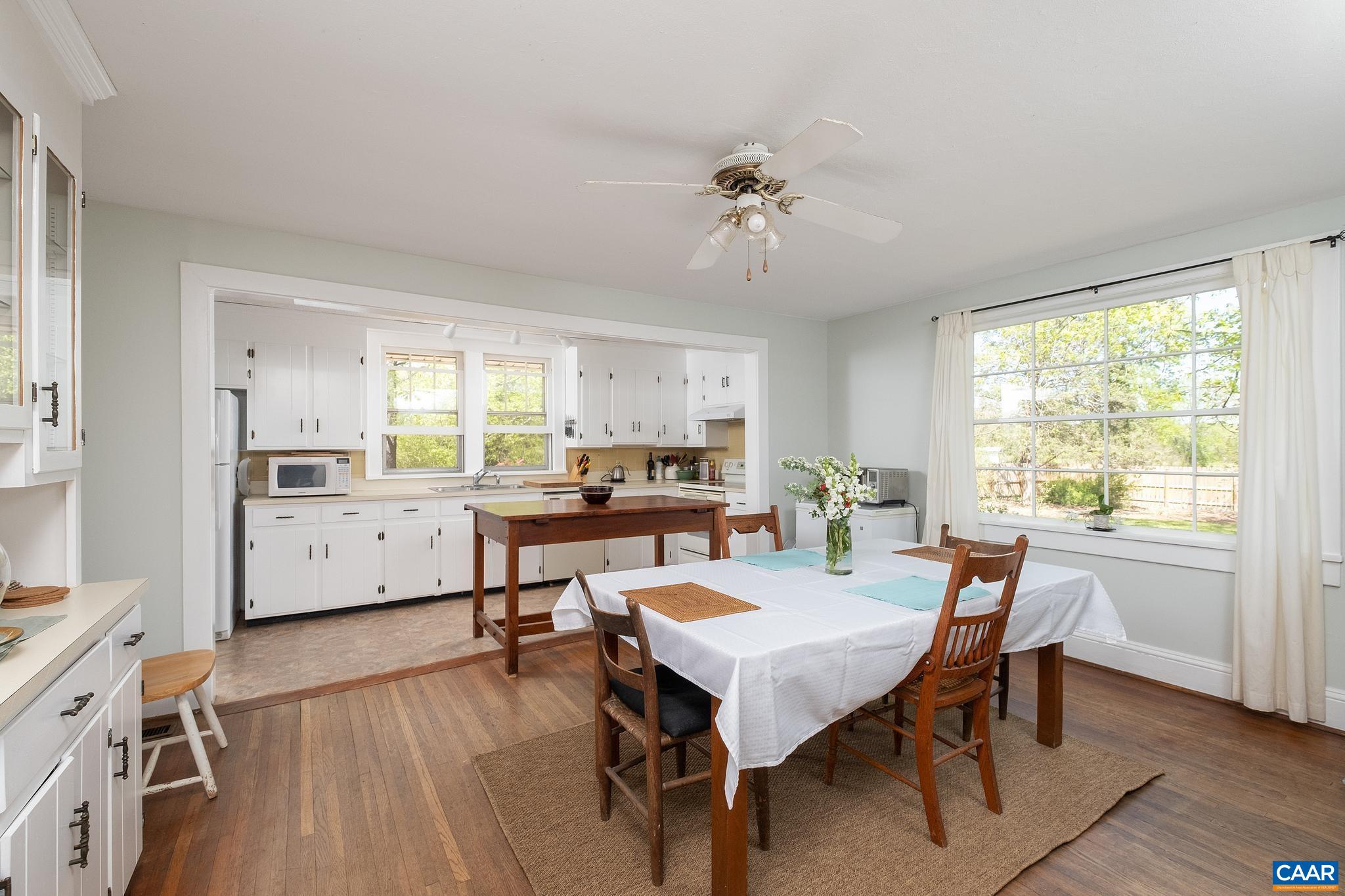 5171 Lowesville Road Arrington, VA 22922 - Photo 19 of 55 a view of a dining room with furniture window and wooden floor