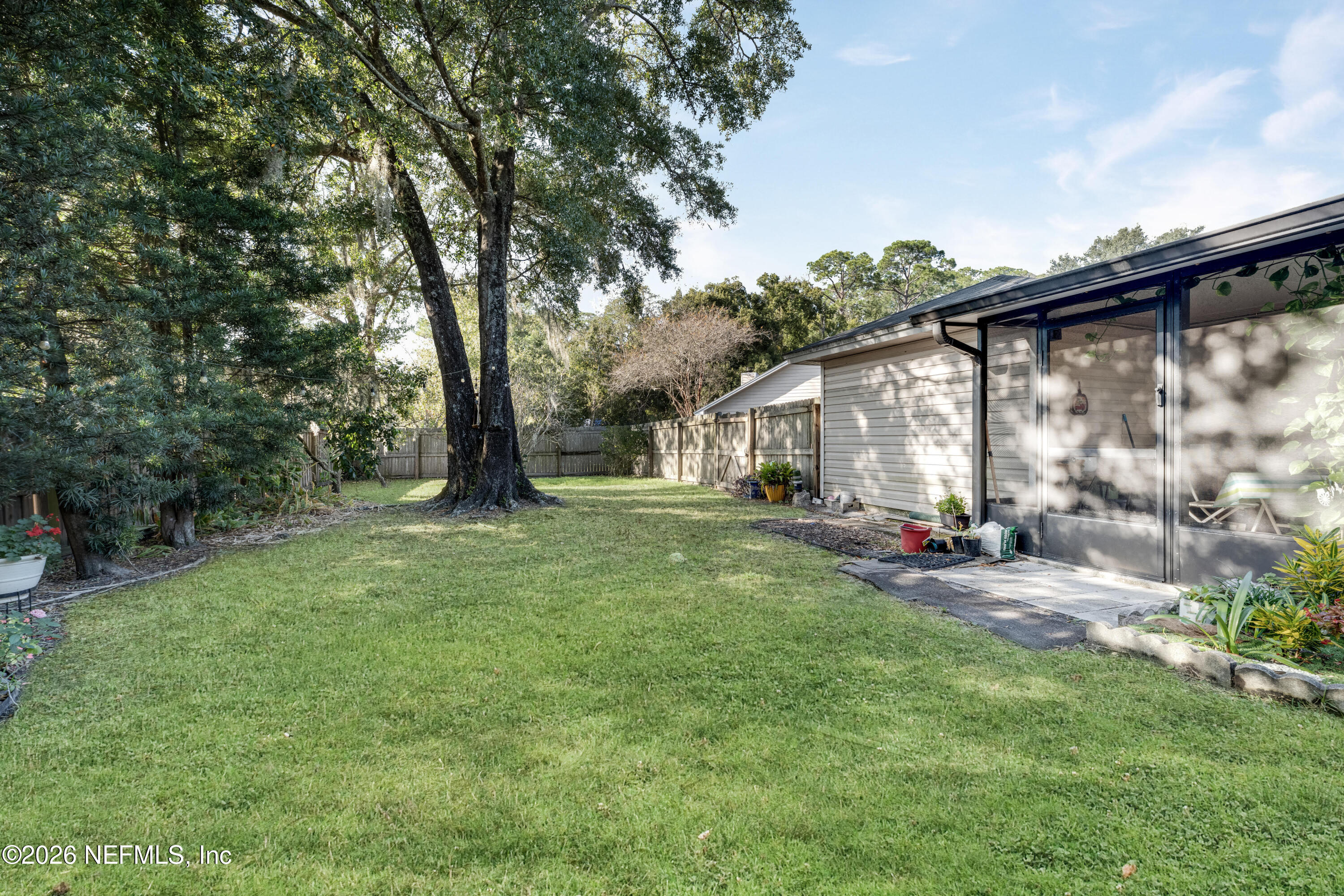 3566 Pond Ridge Court West Jacksonville, FL 32223 - Photo 16 of 17 a view of a house with backyard and sitting area
