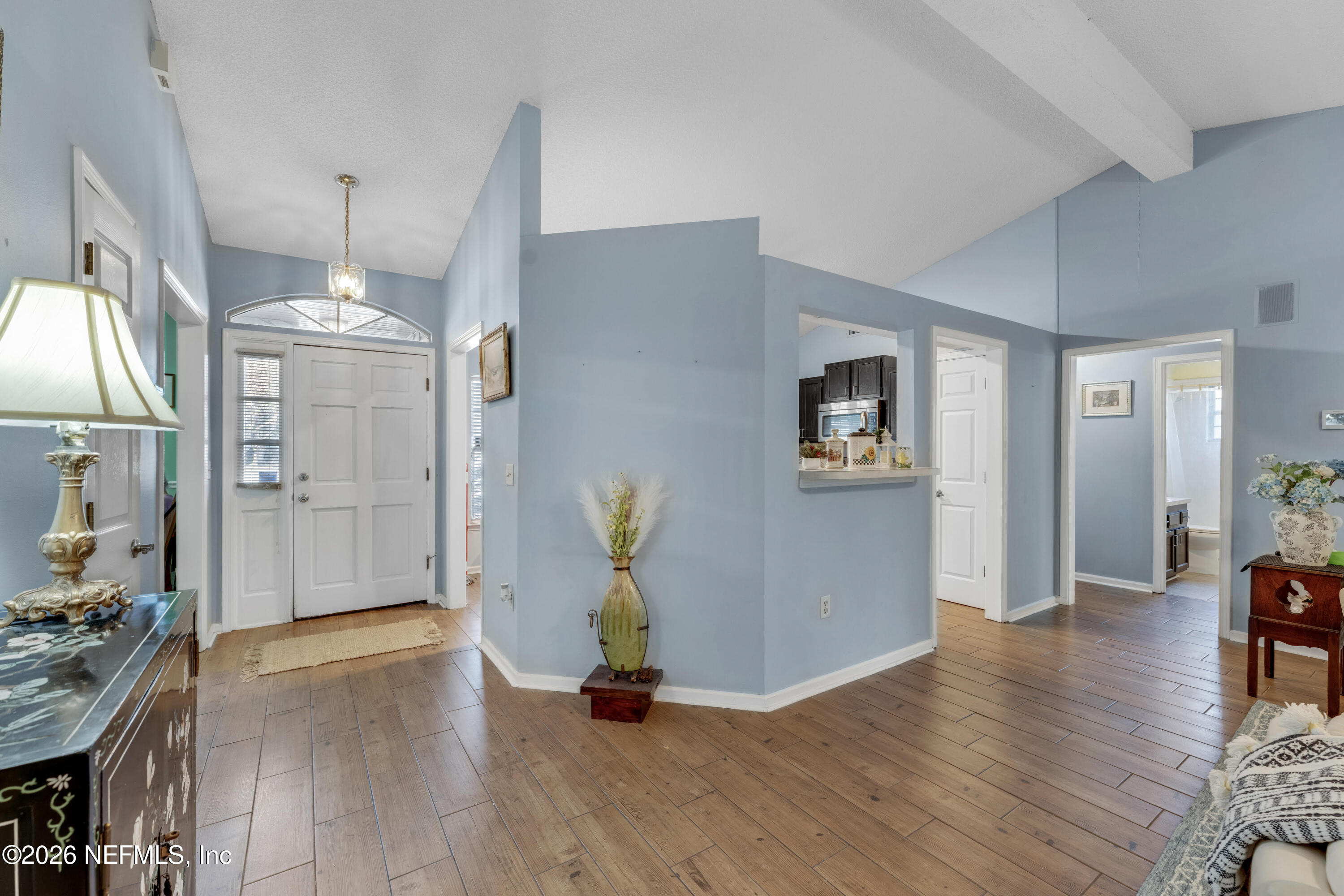 3566 Pond Ridge Court West Jacksonville, FL 32223 - Photo 5 of 17 a view of a hallway with wooden floor and a living room