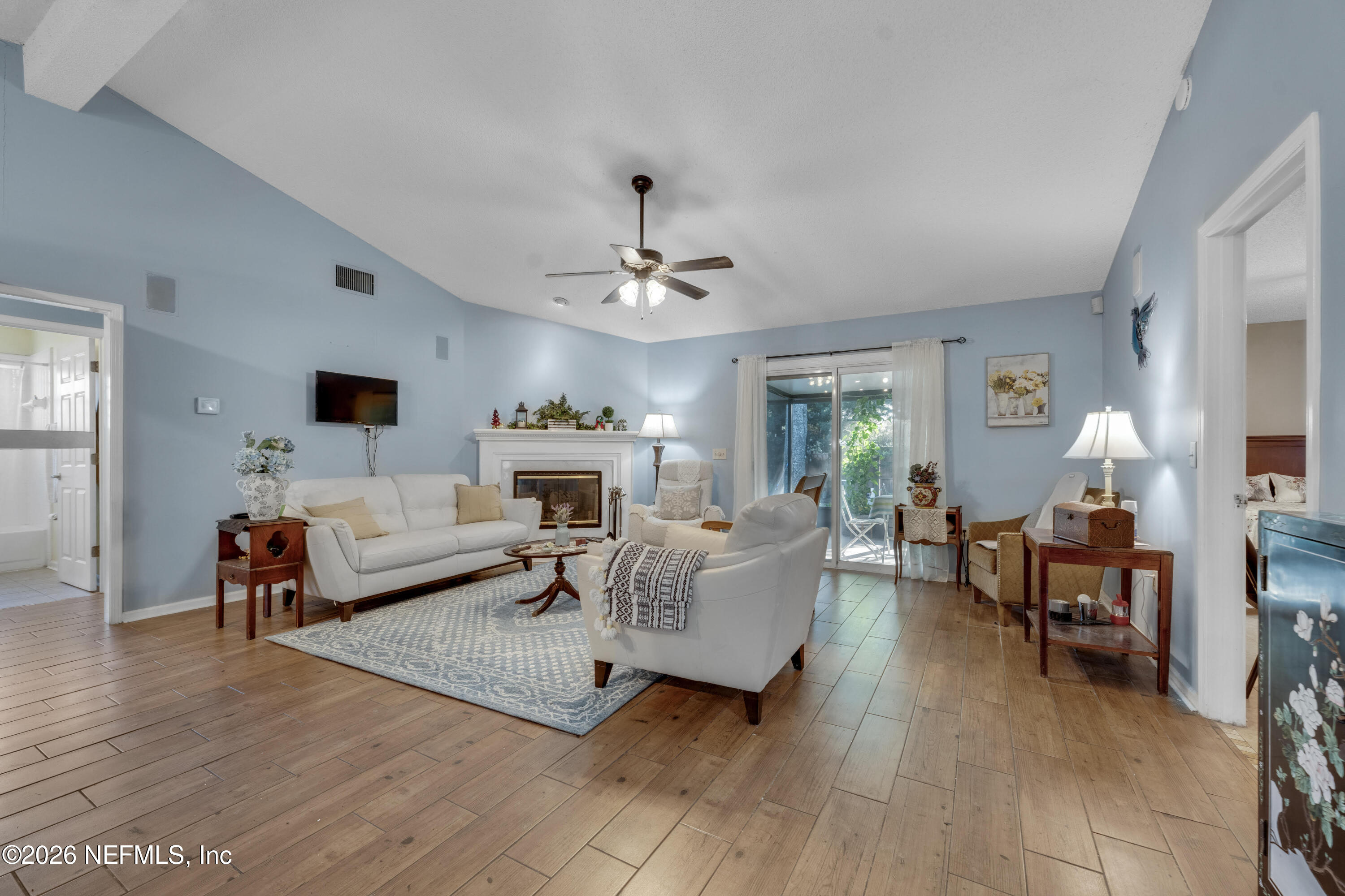 3566 Pond Ridge Court West Jacksonville, FL 32223 - Photo 6 of 17 a living room with furniture and a fireplace