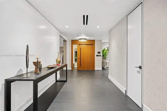 a dining room with furniture a window and wooden floor
