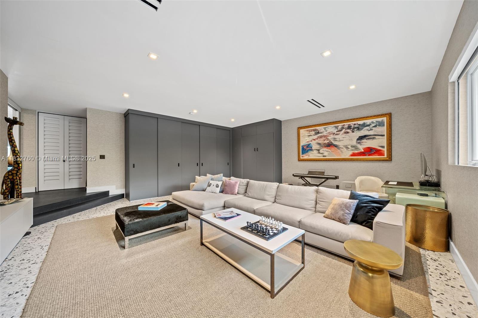 4800 Bay Point Road Miami, FL 33137 - Photo 38 of 74 a living room with furniture and a flat screen tv