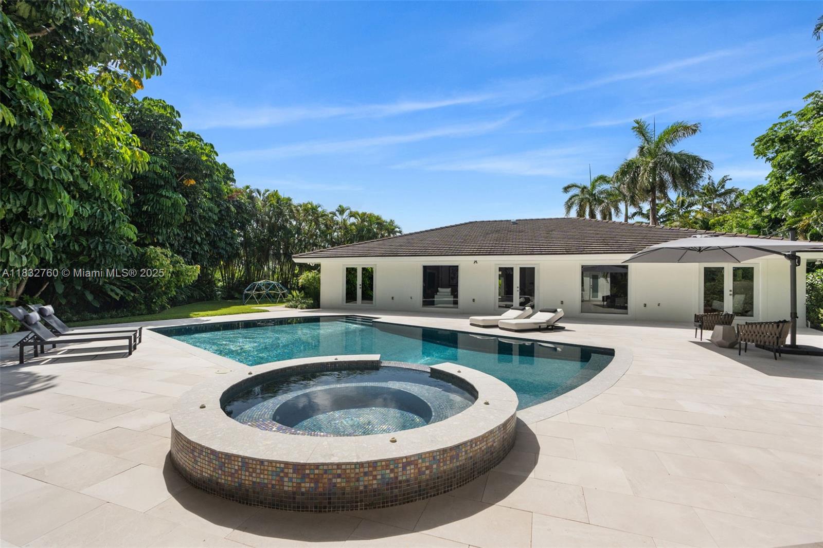 4800 Bay Point Road Miami, FL 33137 - Photo 46 of 74 a view of a house with swimming pool and sitting area