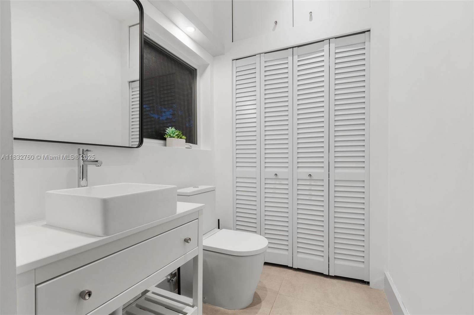 4800 Bay Point Road Miami, FL 33137 - Photo 50 of 74 a bathroom with a sink a toilet and shower